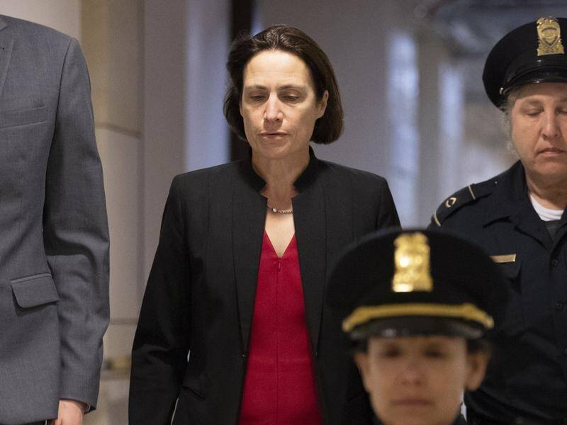Former White House aid Fiona Hill (c) has testified at the impeachment inquiry into President Trump.