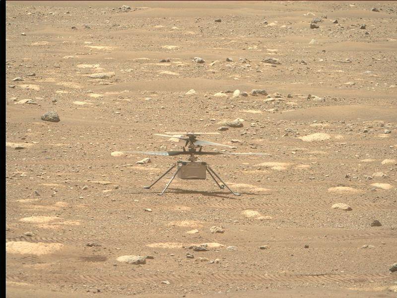 NASA's miniature helicopter has buzzed over the surface of Mars.
