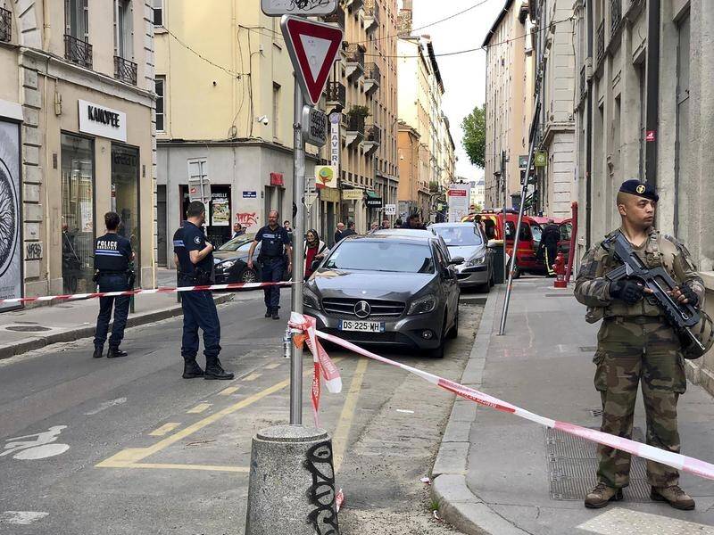 Police in France are hunting a man they say left a bomb in a suitcase outside a Lyon bakery.