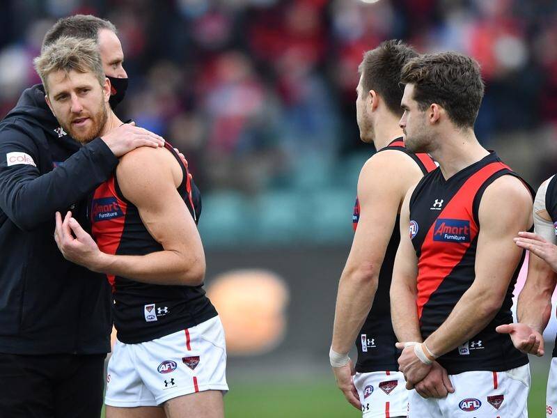 Essendon coach Ben Rutten (l) has confirmed Dyson Heppell (2-l) will captain the Bombers again.