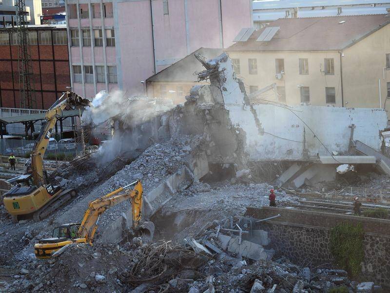 Heavy equipment is moving debris in the search for those missing from the Genoa bridge collapse.