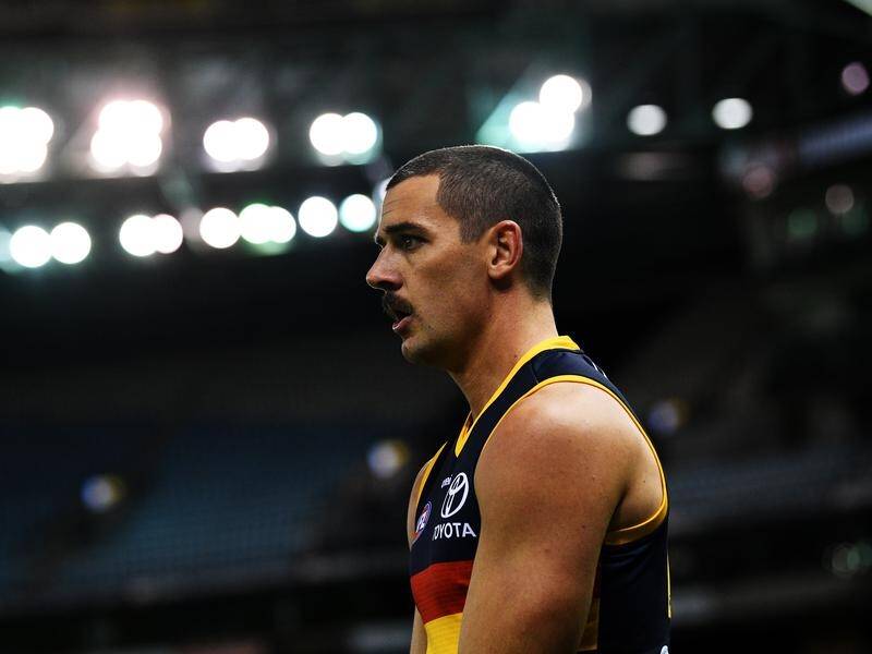 Adelaide's list manager believes the suspended Taylor Walker will return to AFL action next year.