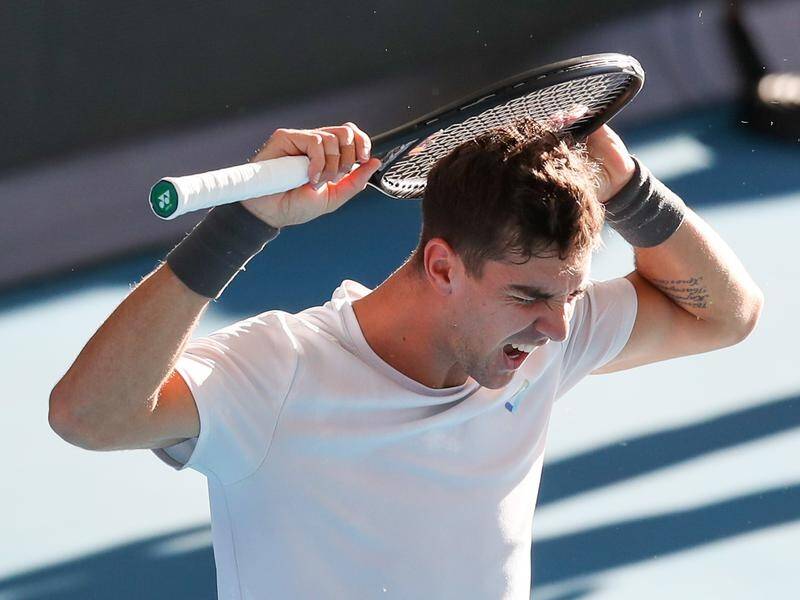 Adelaide title winner Thanasi Kokkinakis has suffered a first-round exit at the Australian Open.