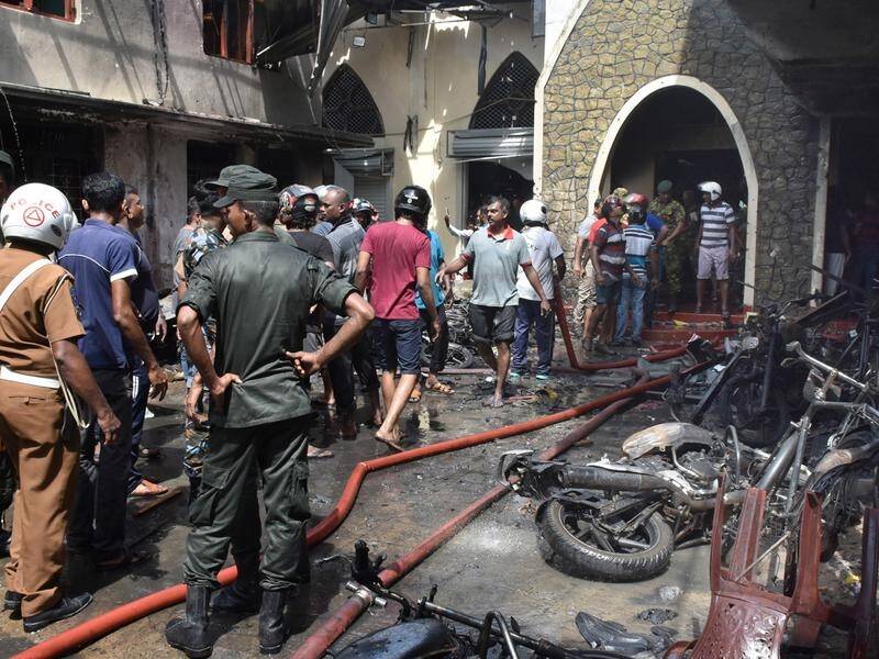 Sri Lanka has invoked emergency powers following suicide blasts at churches and hotels.