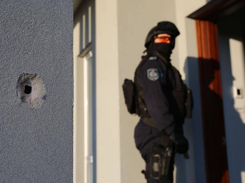 Police are searching for two gunmen who opened fire at a man walking into his western Sydney home.