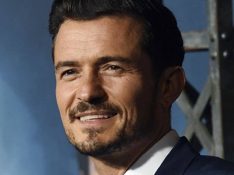 Orlando Bloom felt he was "under a giant magnifying glass" because of his early success.