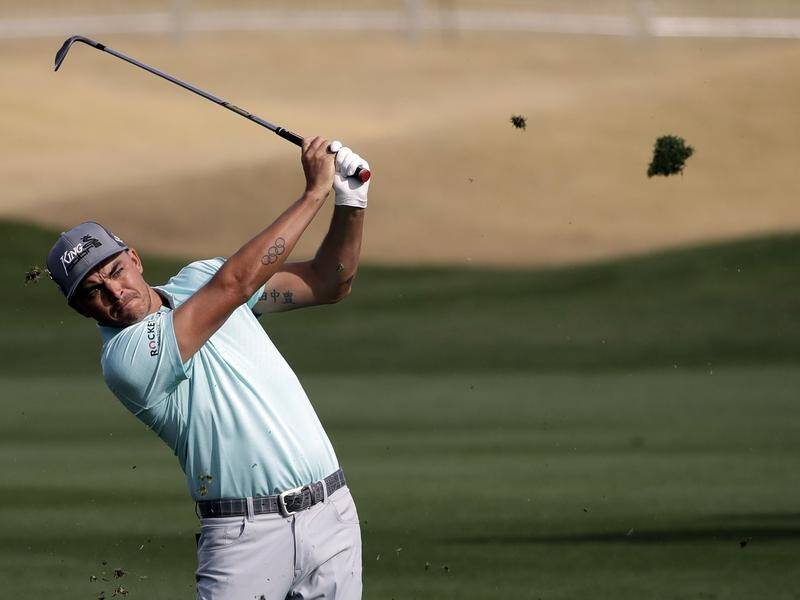 Joint leader Rickie Fowler follows through on his shot during PGA tournament in La Quinta.