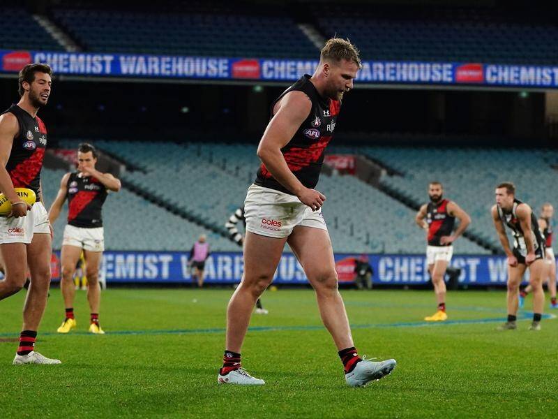 Jake Stringer limps off after starring in the Essendon's win against Collingwood.
