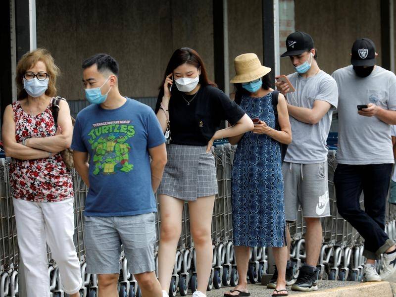 New Jersey's governor has ordered face masks be worn outdoors when social distancing isn't possible.