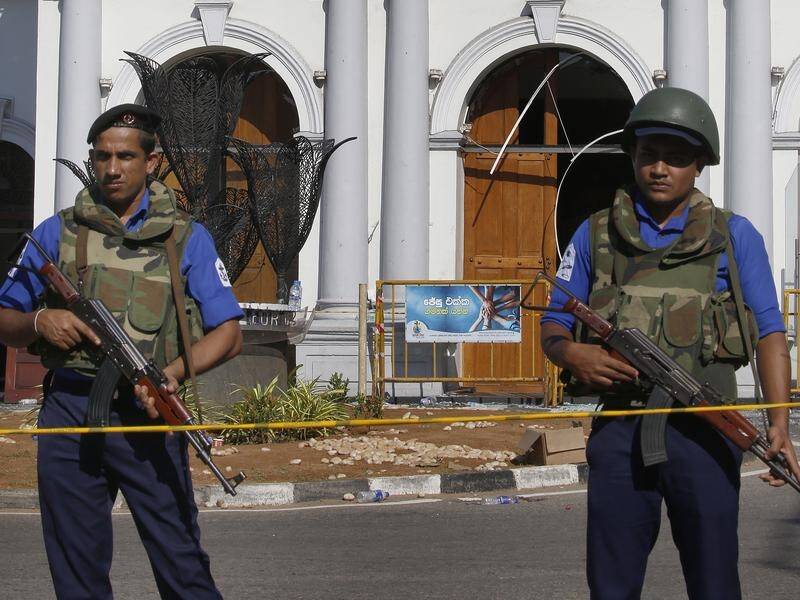 Sri Lankan security personnel stand guard outside St. Anthony's Church in Colombo.
