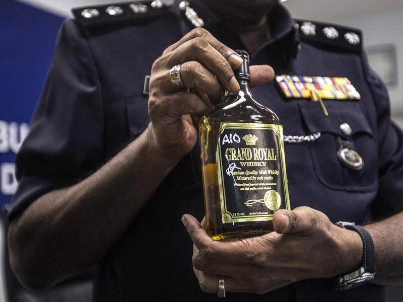 Police in Malaysia are investigating a case of alcohol poisoning that killed at least 21 people.