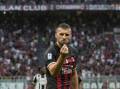 Ante Rebic shows an unusual celebration after scoring AC Milan's fourth goal against Udinese. (AP PHOTO)