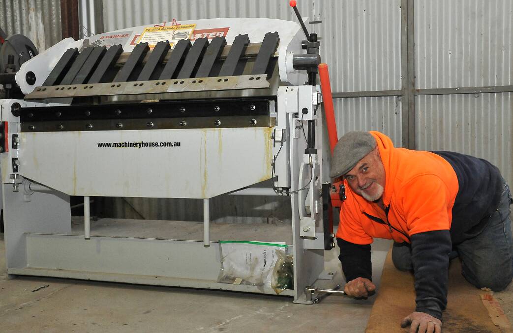 Allan Rees works on boiling the new Pan Burke sheetmetal folder into place at the Men's Shed. Picture: KERRI KINGSTON