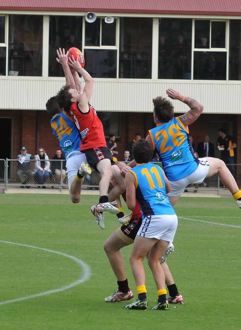Flying high - Warriors forward Andrew Cameron grabs a mark during Stawell Westlift Warriors first win of the season. Picture: MARK McMILLAN