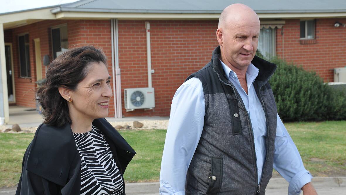 Industry Minister Lily D’Ambrosio walks through the Frewstal abattoir with general manager Greg Nicholls. Picture: BEN KIMBER.