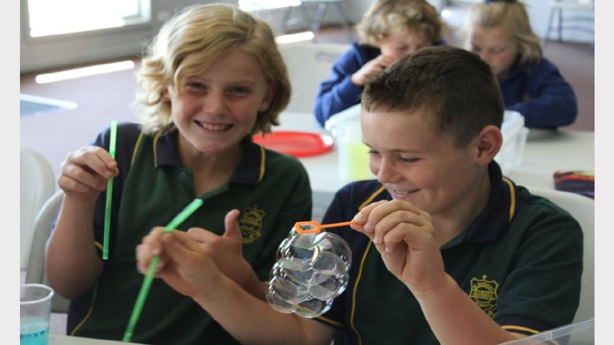 Kobe and Ajay experiment with bubbles during the Bubble-mania session at St Patrick's Primary School.