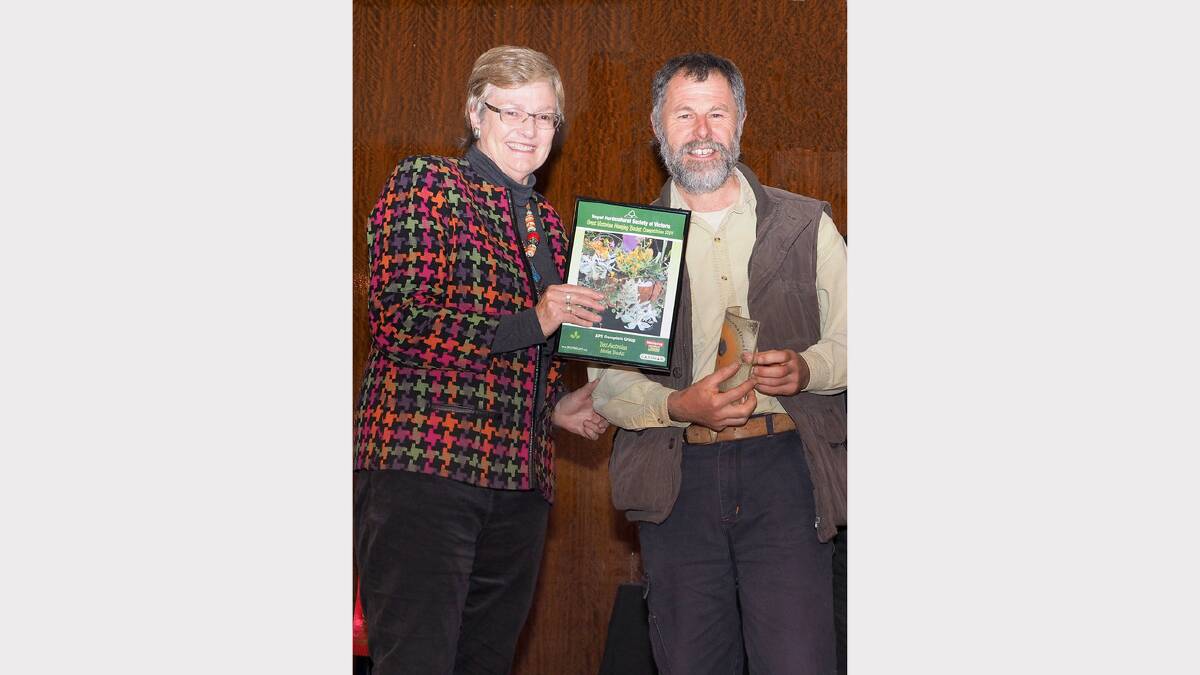 Grampians Group of the Australian Plants Society president, Dave Handscombe, accepts the award from ABC Gardening Show presenter Jane Edmanson.