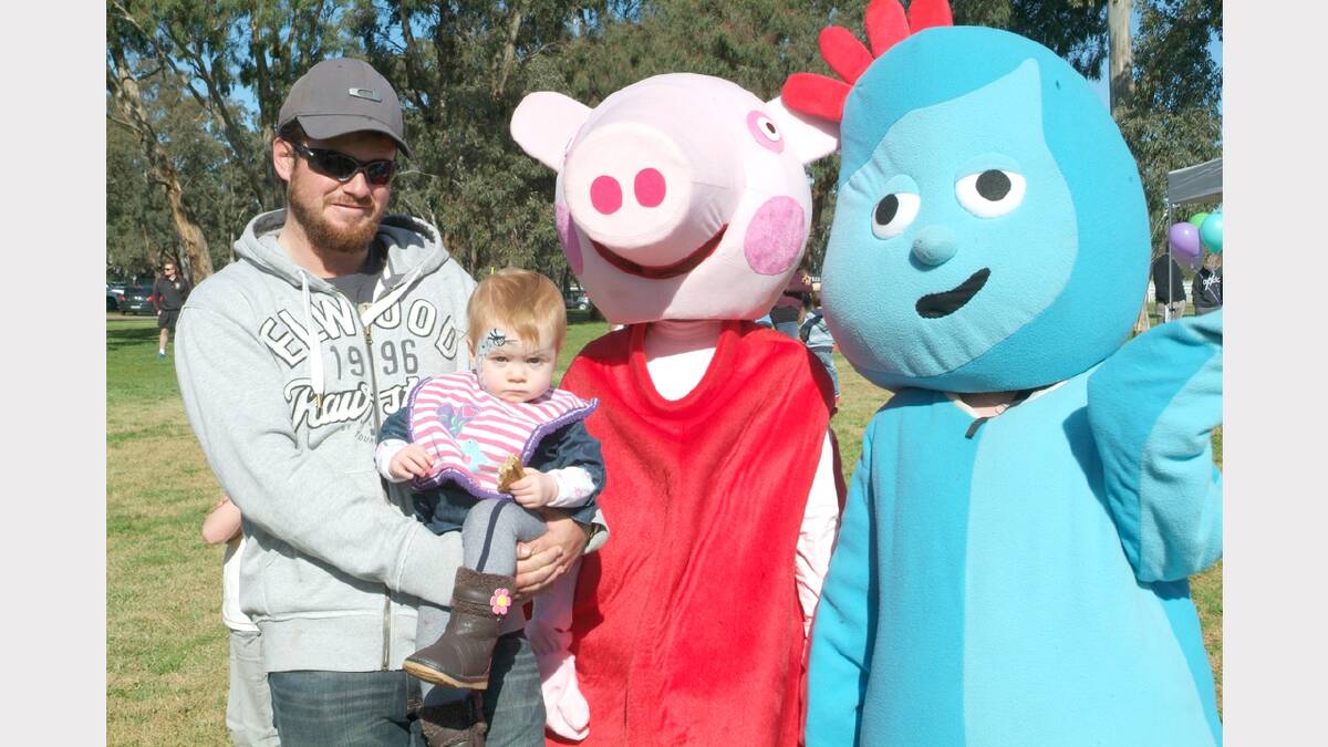 Eddie Swanton of St Arnaud and young Airlie, meet Peppa Pig and Iggle Piggle at the Family Fun Day.