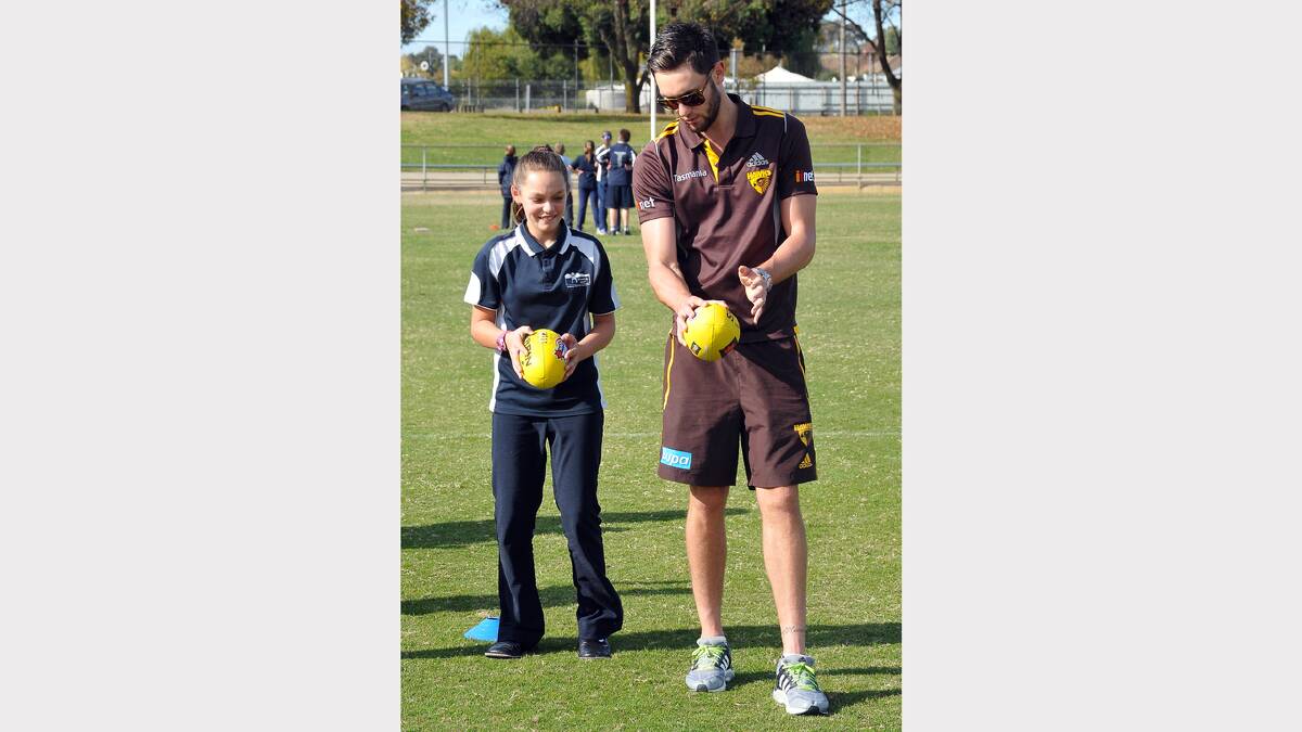 Stawell West student Taylah receives some coaching from Jack Gunston.