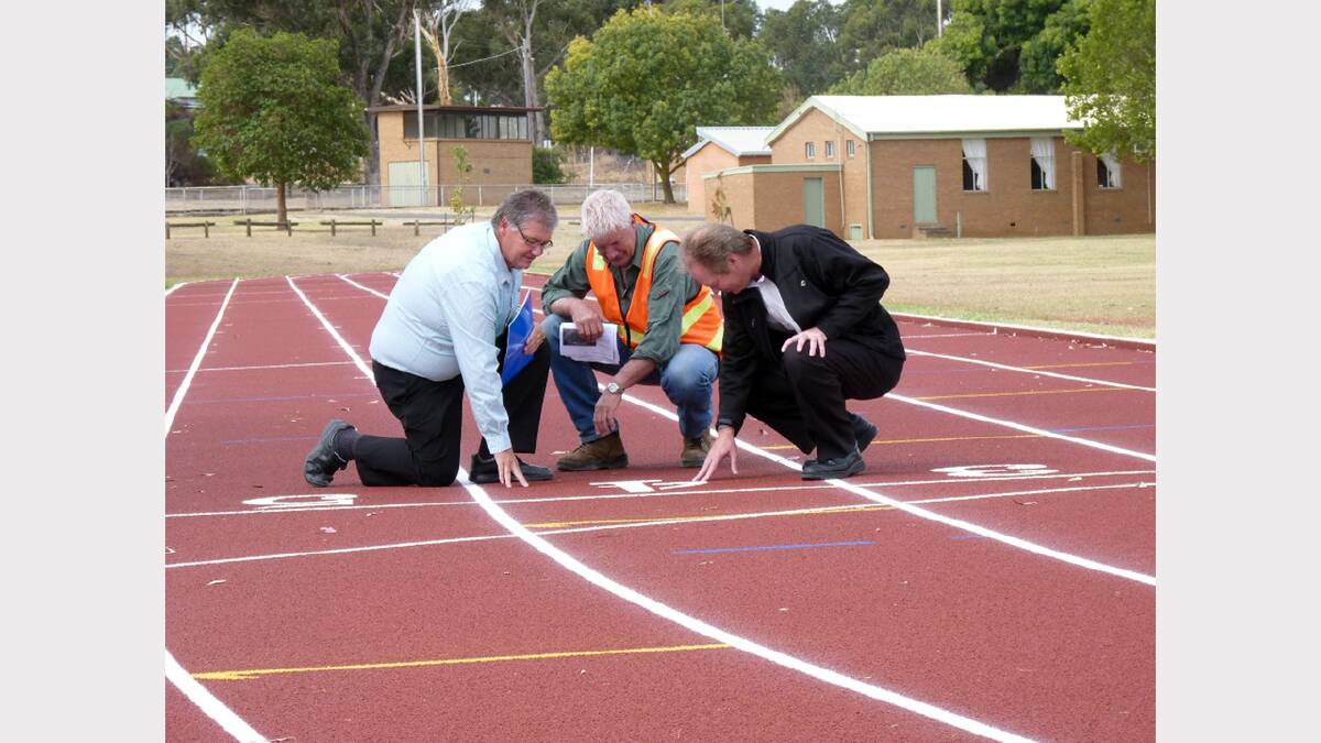 Greg Little, John Hunt and Tony Dark from the Northern Grampians Shire Council inspect the new synthetic track at North Park.
