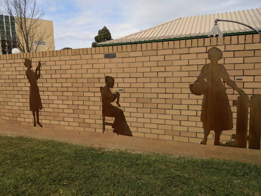 MYSTERY: The appearance of three steel figurines on a previously blank wall of the Stawell Regional Library has been the subject of much discussion.