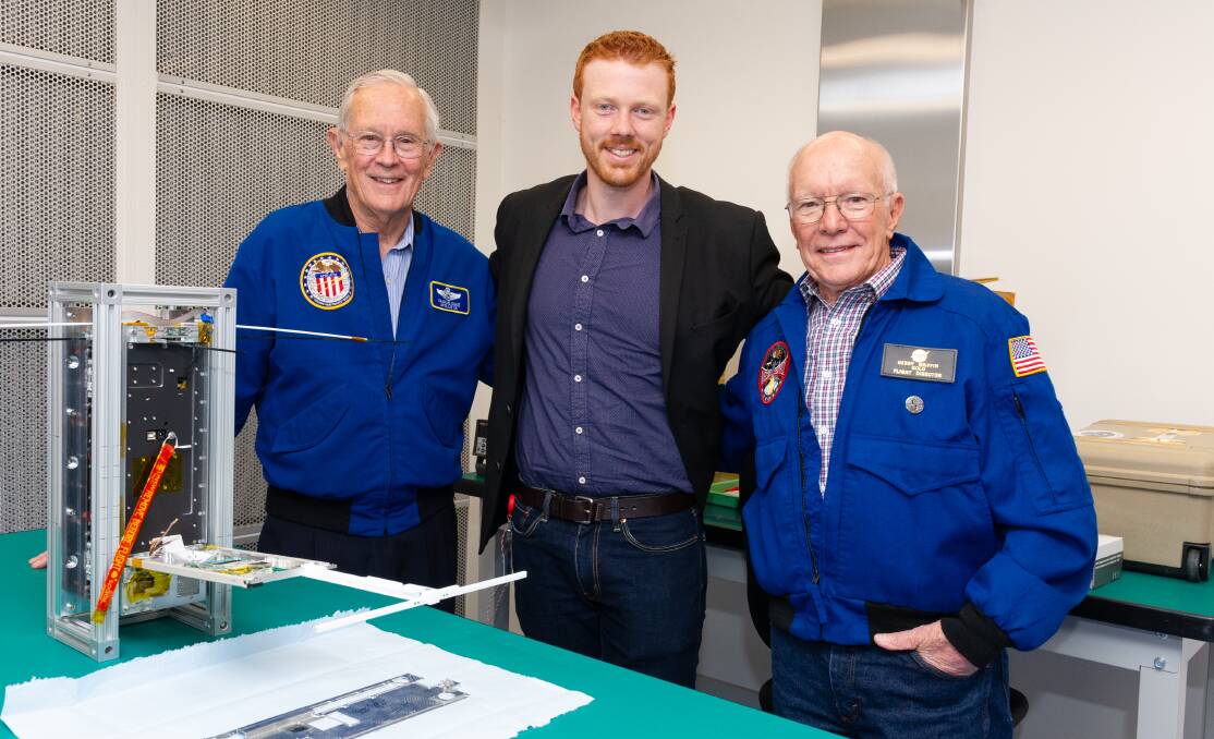 Chris Capon, centre, with Apollo 16 astronaut Charlie Duke and flight director Gerry Griffin.