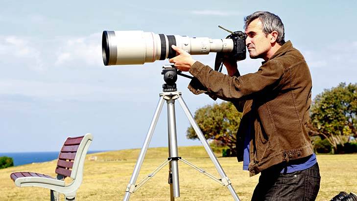 Long shot ... Ben Rushton aims for his subject using a Canon EOS 1D Mark IV camera, a 600 millimetre lens and a 2x converter to double the magnification of the lens. He shot with a 1/10000th second shutter speed.