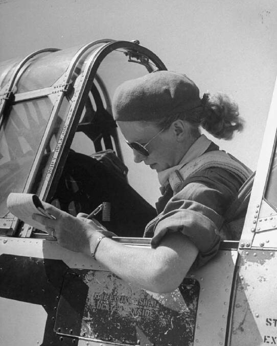 Jean Pearson gives her Aviators a run in the setting for which they were designed; the metal-rimmed glasses were patented in 1937. <i>Source: Ray-Ban</i>