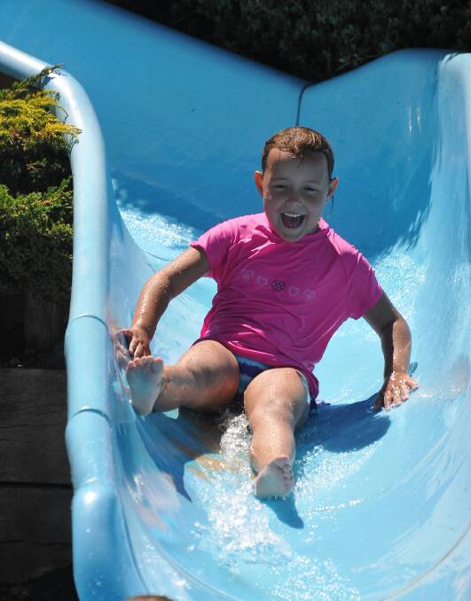 Macey Hammer keeps cool on one of the water slides at the Stawell Leisure Complex Outdoor Pool. Pictures: MARK McMILLAN.