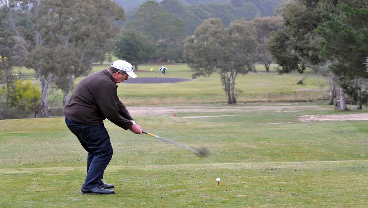 Bendigo veteran golfer Kerry Robertson was about to hit down the fairway towards the scrape, playing in the veterans championships at the Grange Golf Club. Picture: KERRI KINGSTON