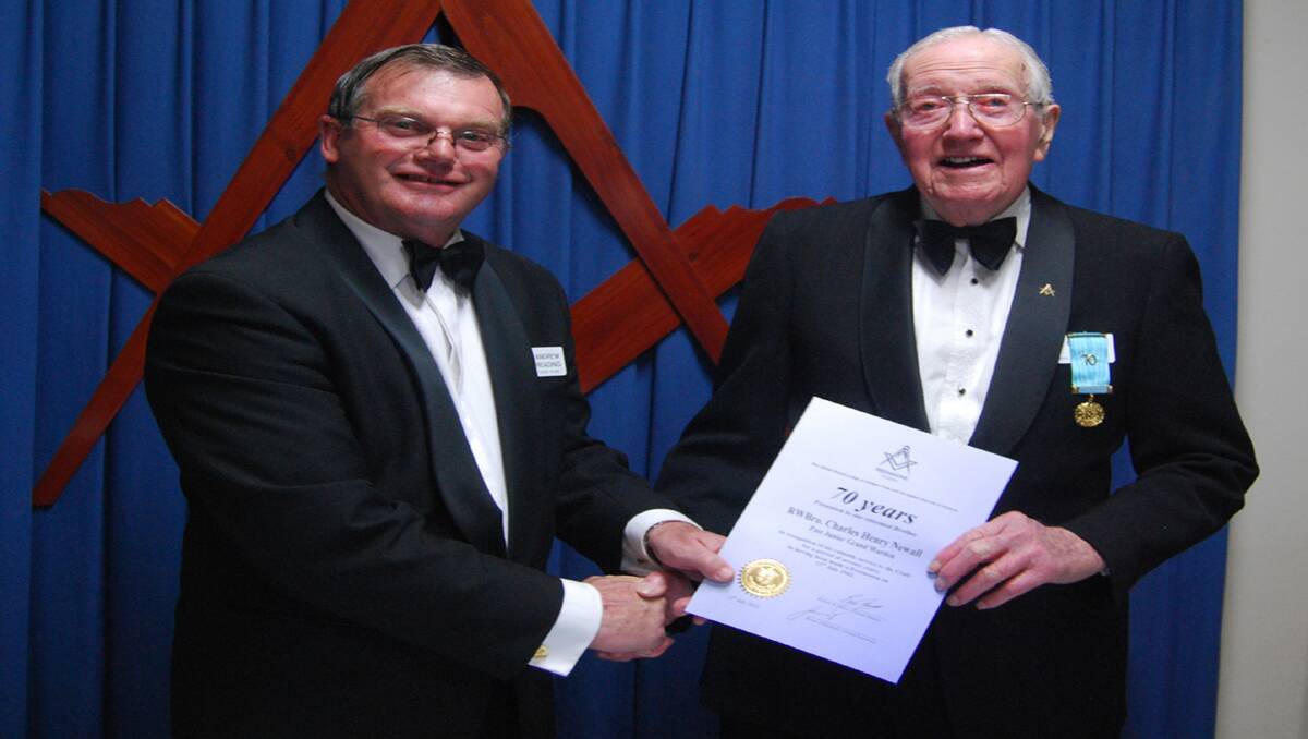 Right Worshipful Brother Andrew Reading presents Marnoo's Charlie Newall with his certificate, recognising 70 years of service to Freemasonry in both Marnoo and Stawell. 
