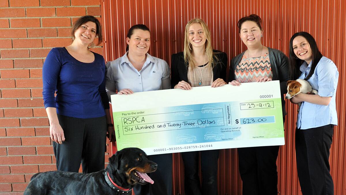 Pictured with the cheque for $623 raised during a cupcake fundraiser to support the work of the RSPCA for the prevention of cruelty to animals are L-R Linley Hoiles, Robyn Sanderson, Ashleigh Dark, Amy Rhodes and Carlee Vokes. Picture: KERRI KINGSTON