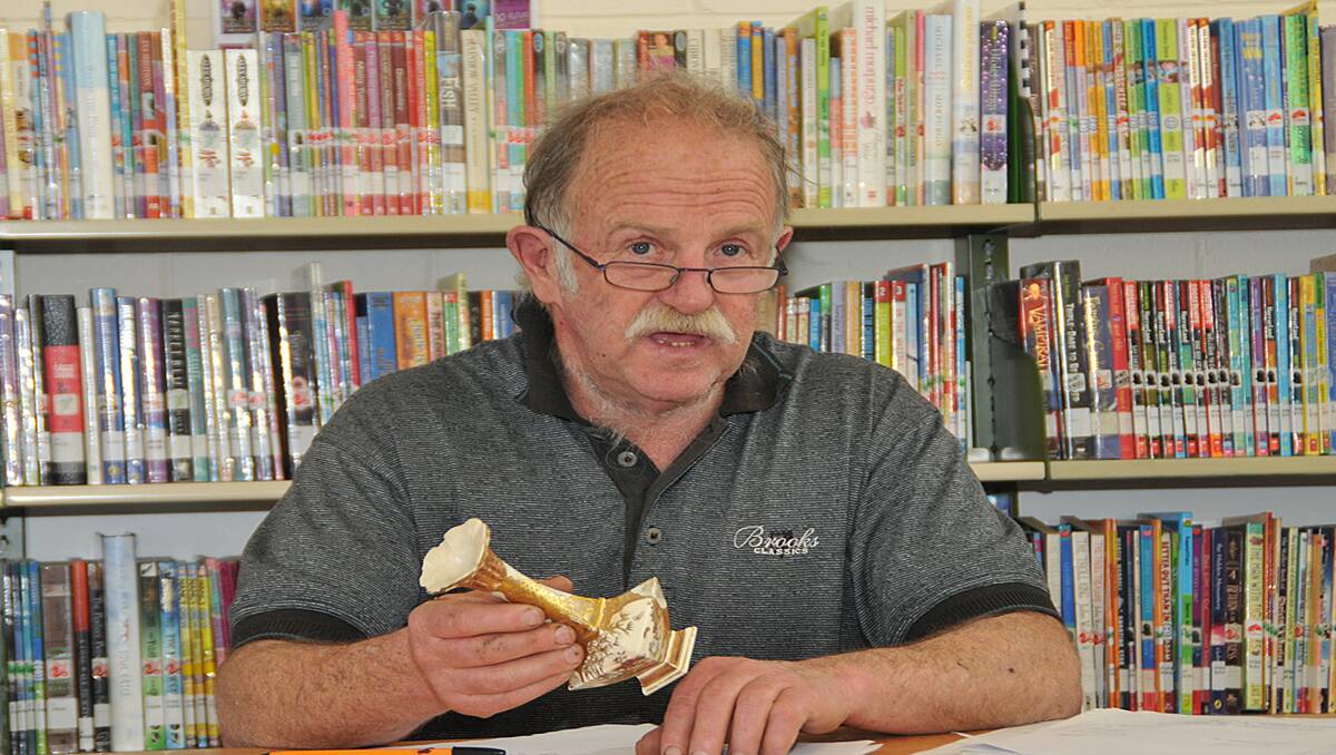 Antiques dealer and auctioneer Bruce Lowenthal from Portland was on hand once again to assess and deliver the value of antique items during Appraisal Day at the library. Picture: MARK McMILLAN